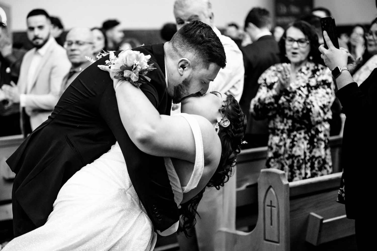 Black and white collage of candid wedding moments showing dancing and celebrations.