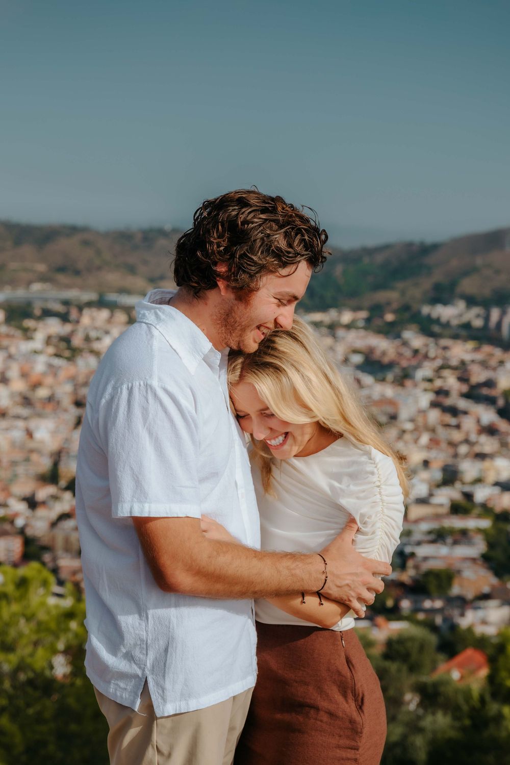 Joyful laughter of couple realizing they are getting married.