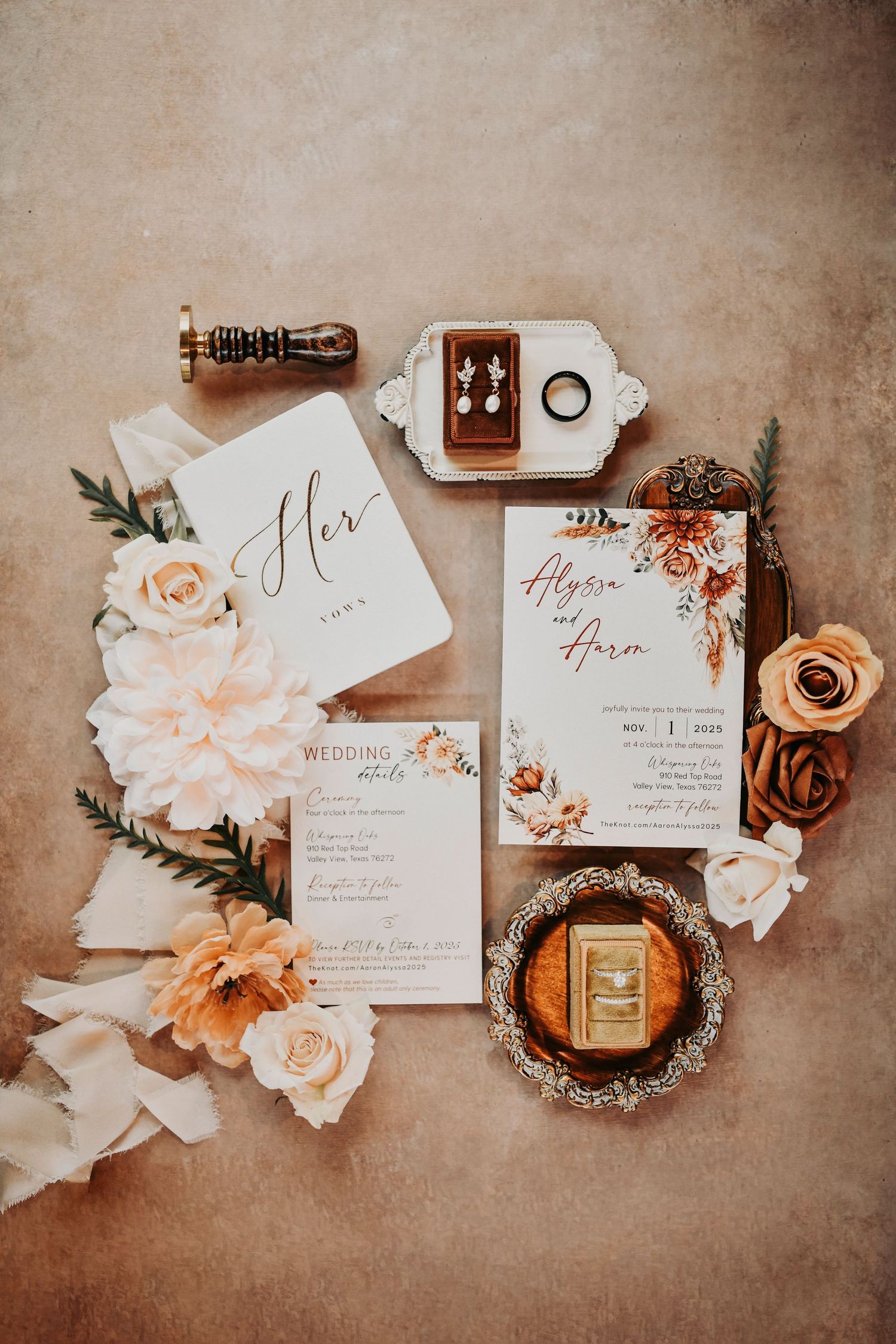 Editorial wedding flat lay of invitation suite, jewelry, and bridal accessories in natural light