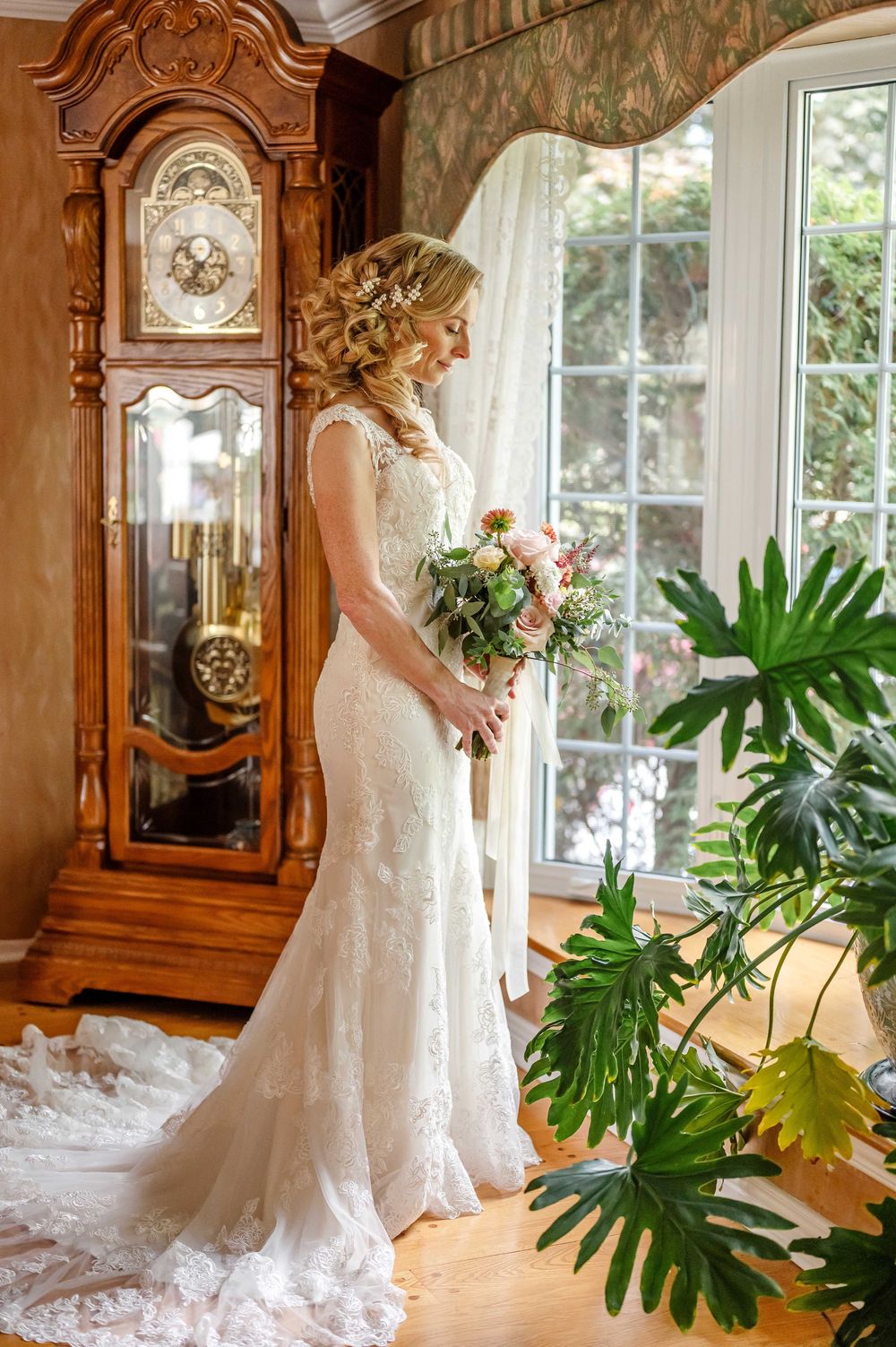 Elegant bridal portraits with lace dress against vintage furniture and indoor plants.