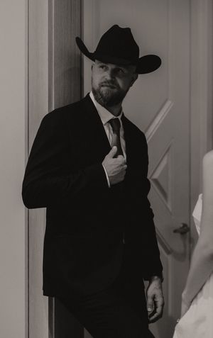 Black and white photos of a formal couple in a corridor.