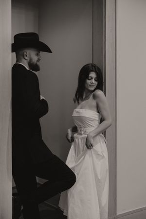 Black and white photos showing movement and romance in a hallway setting.