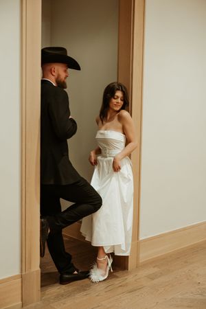 Artistic black and white shots showing movement in a minimalist hallway setting.