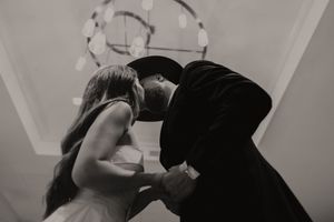 Black and white photo series showing romantic interaction in an indoor setting.