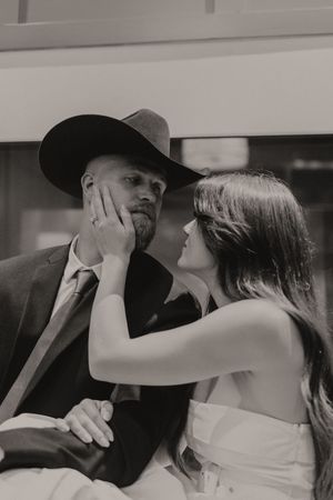 A romantic black and white photo series showing intimate moments between a couple in formal attire.