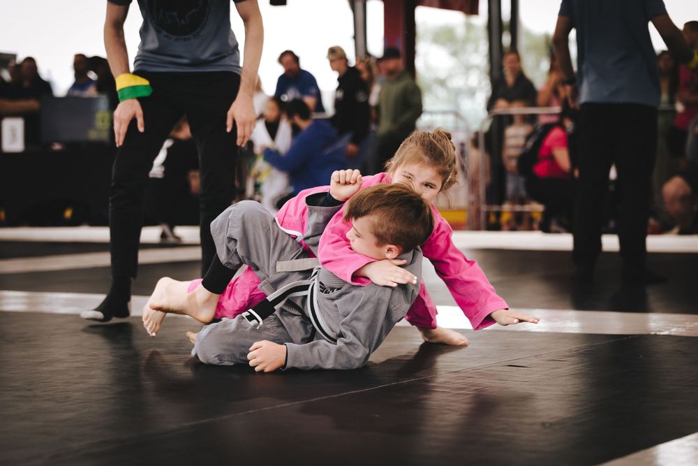 Students lying on floor during dance or exercise practice session.