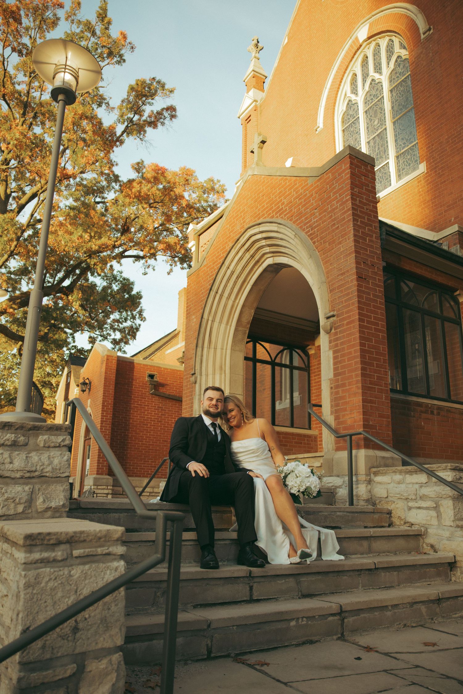 Close-up photos of legs showing contrasting black pants and white ballet flats in multiple romantic poses.