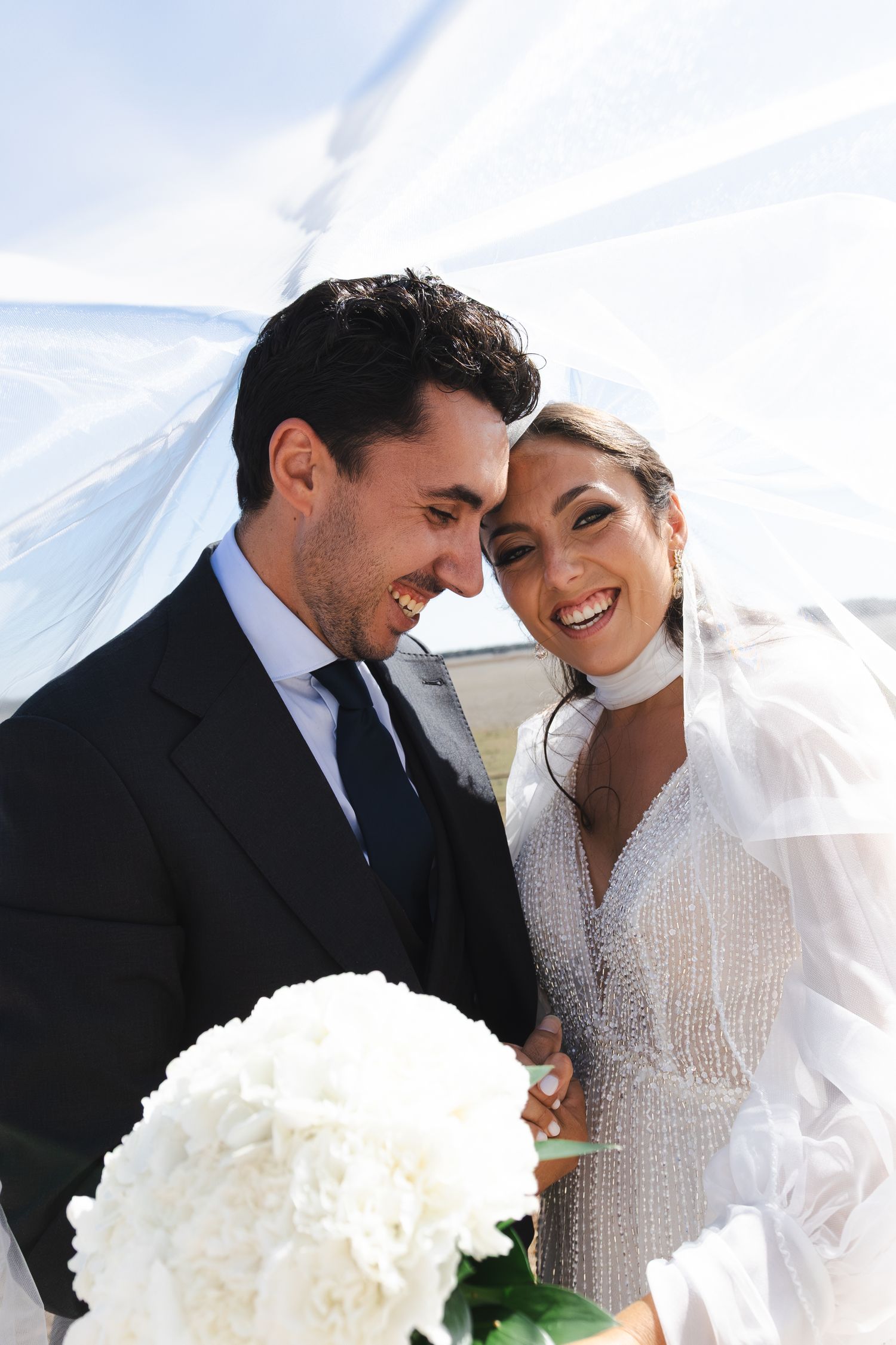 A romantic black and white wedding photo montage showing three intimate moments between newlyweds.