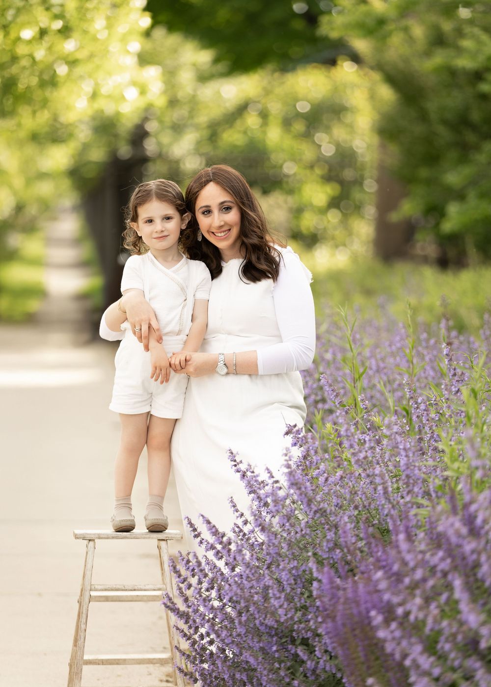 A collection of outdoor photos showing sweet family moments on a wooden bench near blooming lavender.
