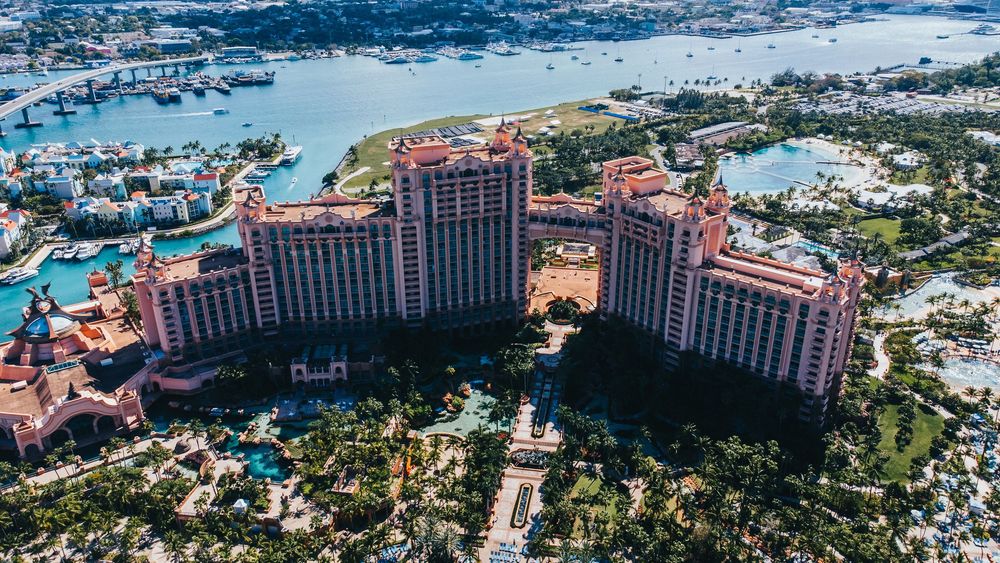 Bird's eye view of a large resort complex with multiple pools and landscaped grounds.