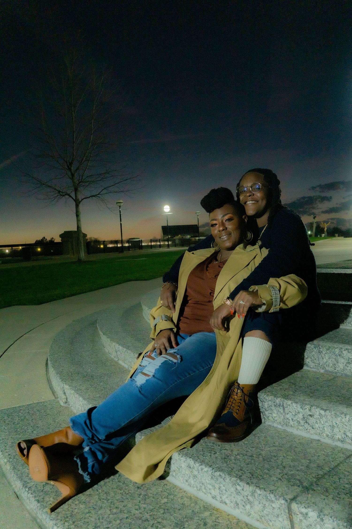 A sequence of images showing people reclining on a curved concrete structure at night under moonlight.