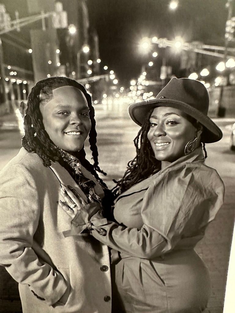 Black and white photo series showing two people laughing and embracing outdoors at night on a city street.