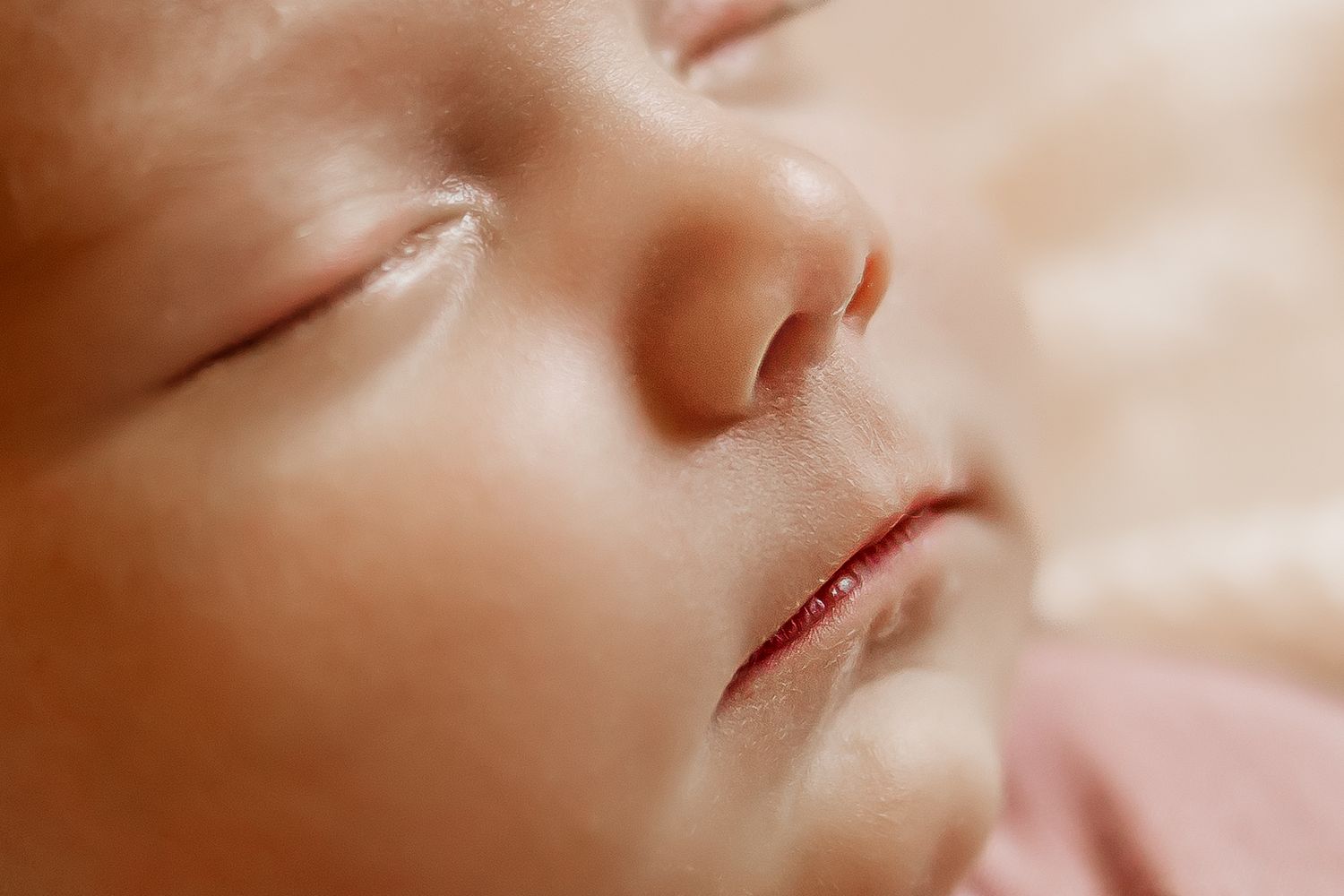 A Honolulu Newborn photographer captures the up close details of a newborn baby's face.