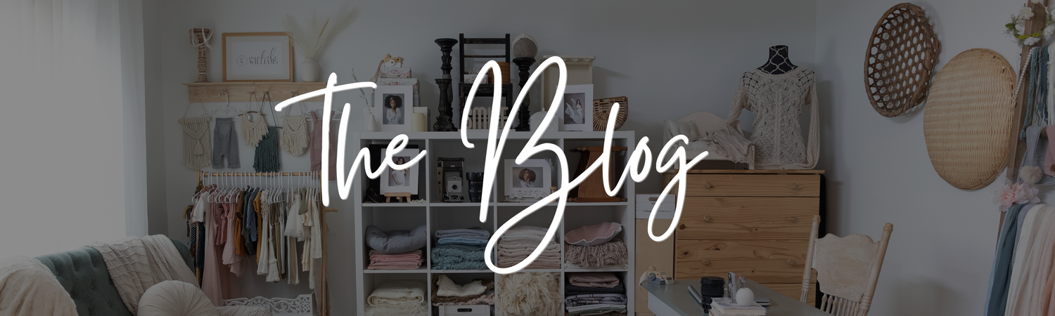 A cozy home office corner with bookshelves, clothing rack and modern decor in neutral tones.