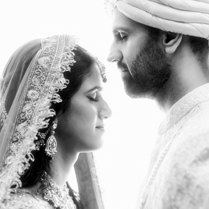 Black and white wedding photos from Houston showing romantic side profiles of a couple in traditional South Asian attire.