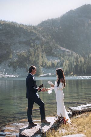 Couple exchanging vows during an intimate mountain elopement in North Idaho