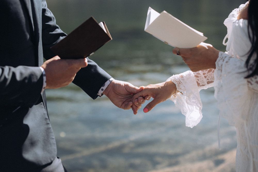 Couple exchanging vows during an intimate mountain elopement in North Idaho