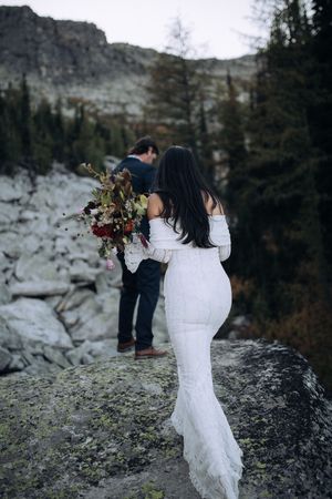 Couple exchanging vows during an intimate mountain elopement in North Idaho
