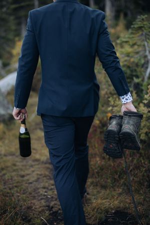 Spokane elopement champagne and hiking boots groom