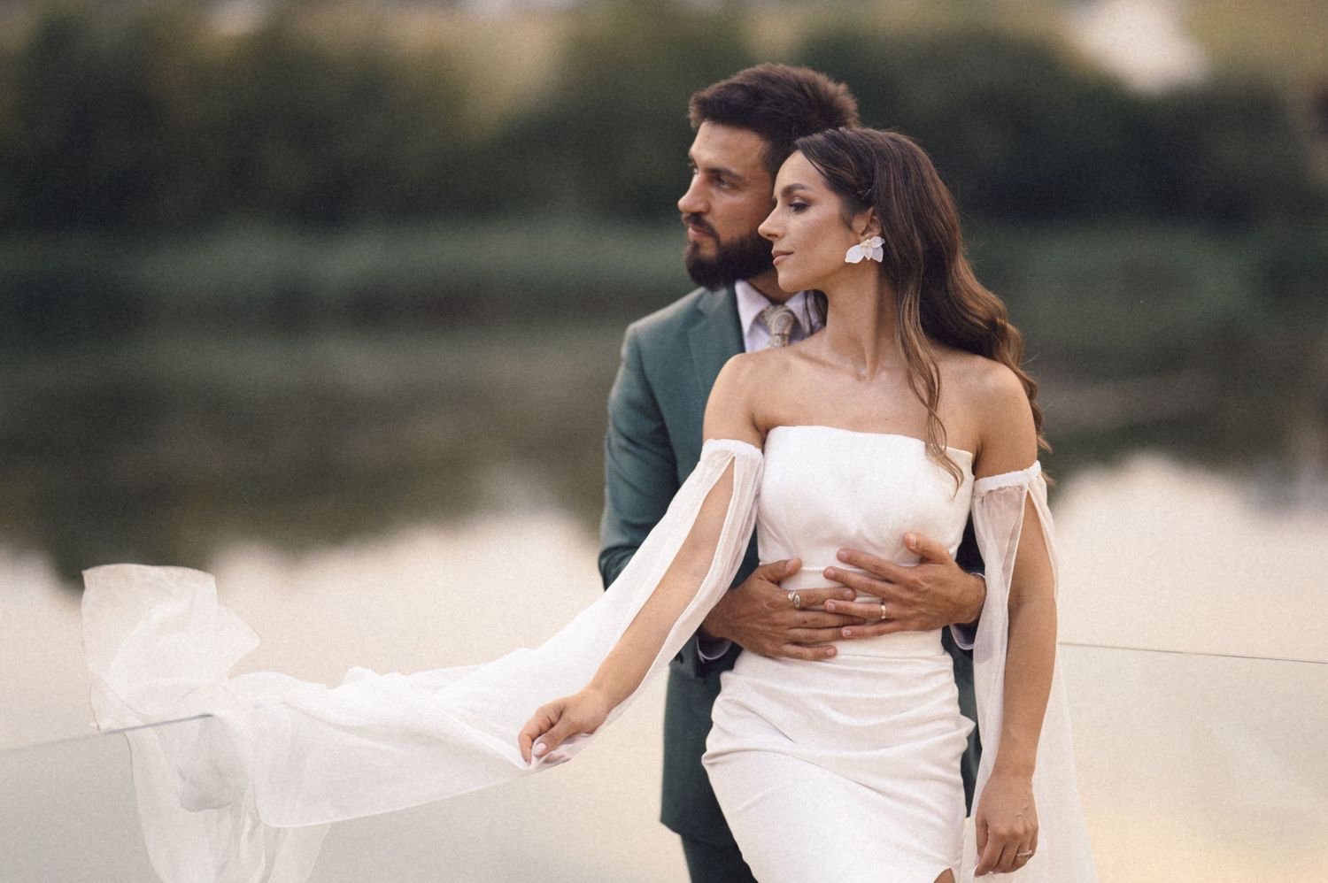 A couple in wedding attire shares intimate moments in a series of romantic outdoor portraits at sunset.