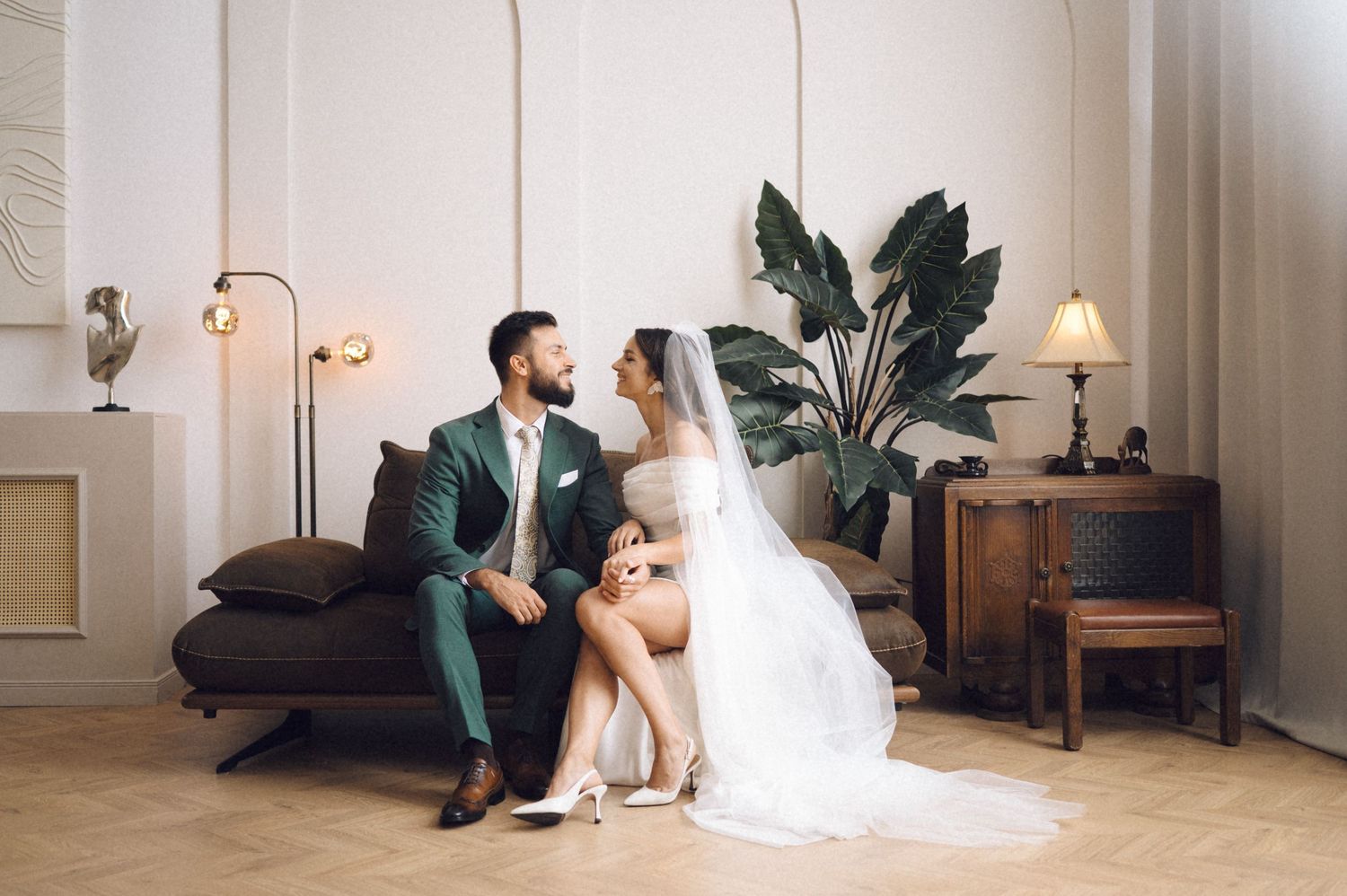 Wedding photos arranged in a horizontal strip showing tender moments between newlyweds in an elegant indoor setting.