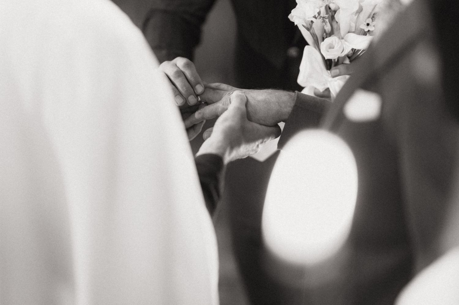 A bride and groom share a tender moment during their first dance at an elegant wedding reception.