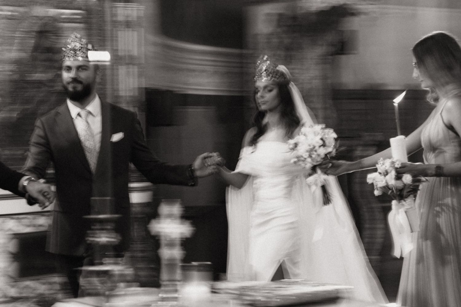 A series of black and white wedding photographs showing couples dancing and celebrating at a reception.