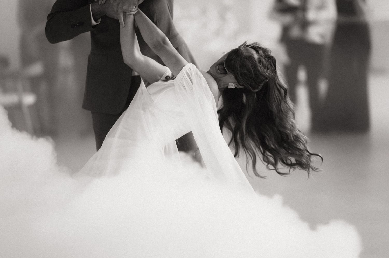 A romantic black and white wedding photoshoot showing tender moments between the bride and groom.