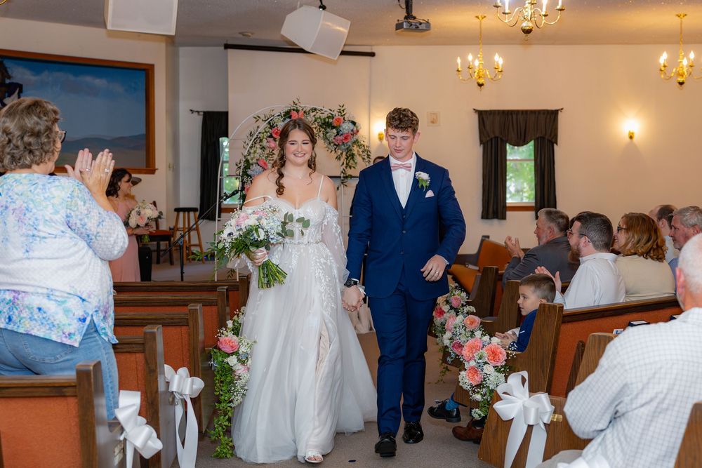 A collage of six wedding reception photographs showing dancing, decorations and formal attire in an indoor venue.