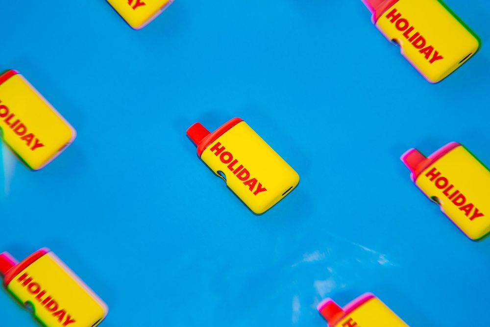 Colorful yellow and pink sticky notes arranged in a diagonal pattern against a bright blue background.