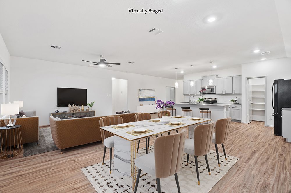 A contemporary office interior with white walls, wood floors, and minimalist furnishings creates a bright workspace setting.