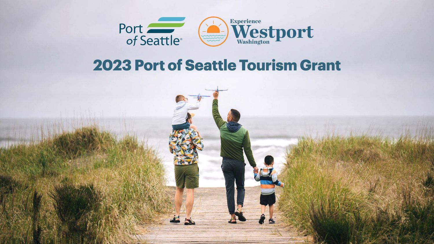 A series of people walking along a coastal trail at Westport Beach in Washington state during a sunny day.
