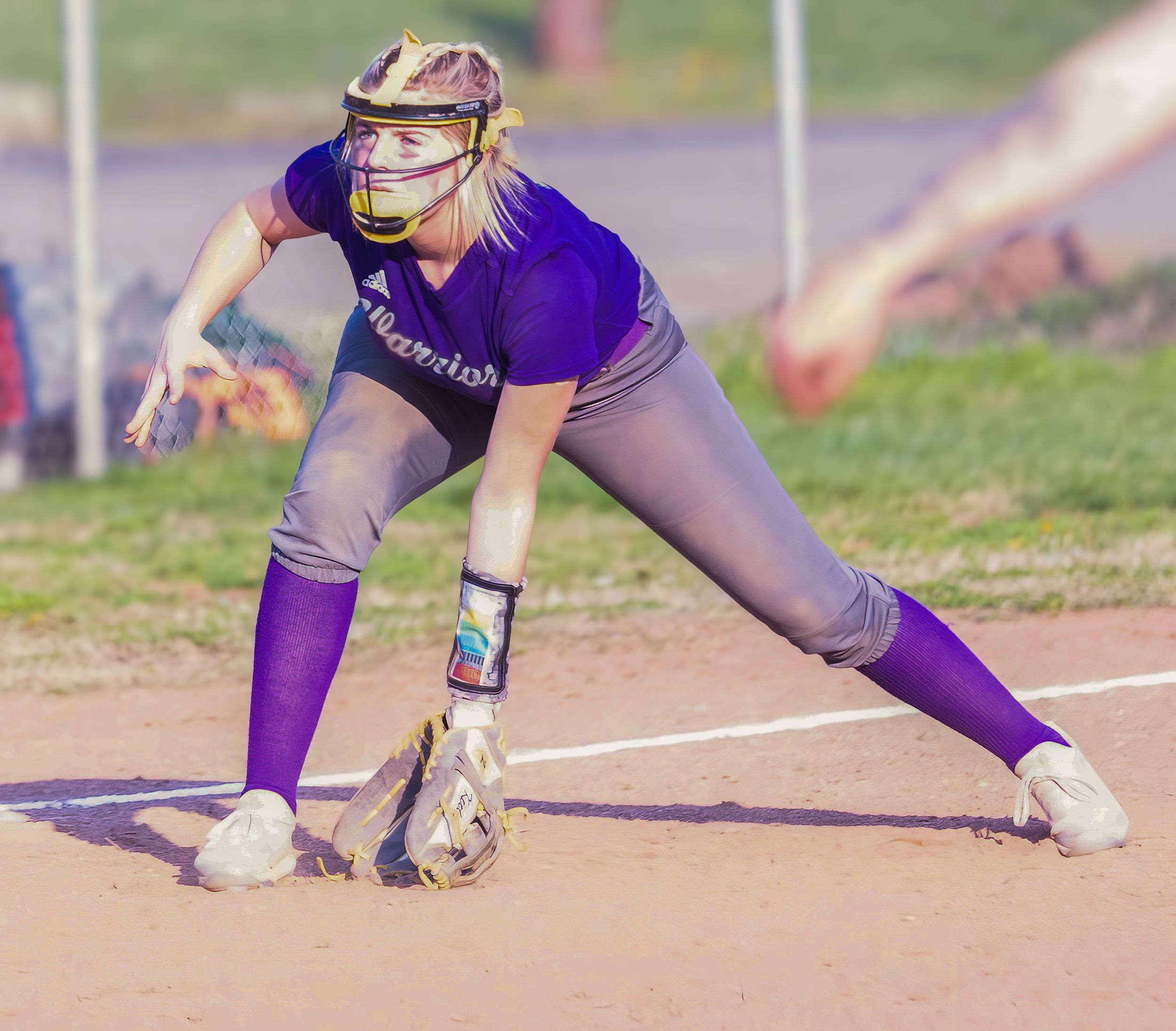 Softball player in purple uniform fielding a ground ball in defensive stance.
Softball riverside high school kanawha county