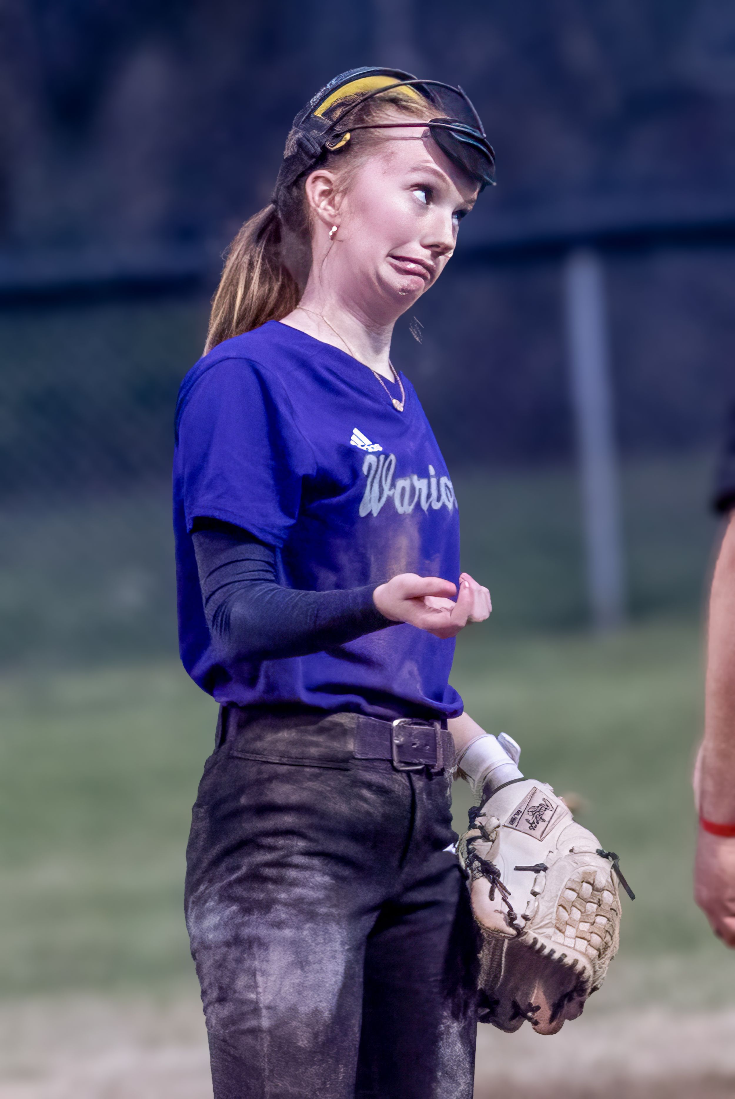 Softball player in blue uniform with protective helmet and glove during a game.
Softball riverside high school kanawha county