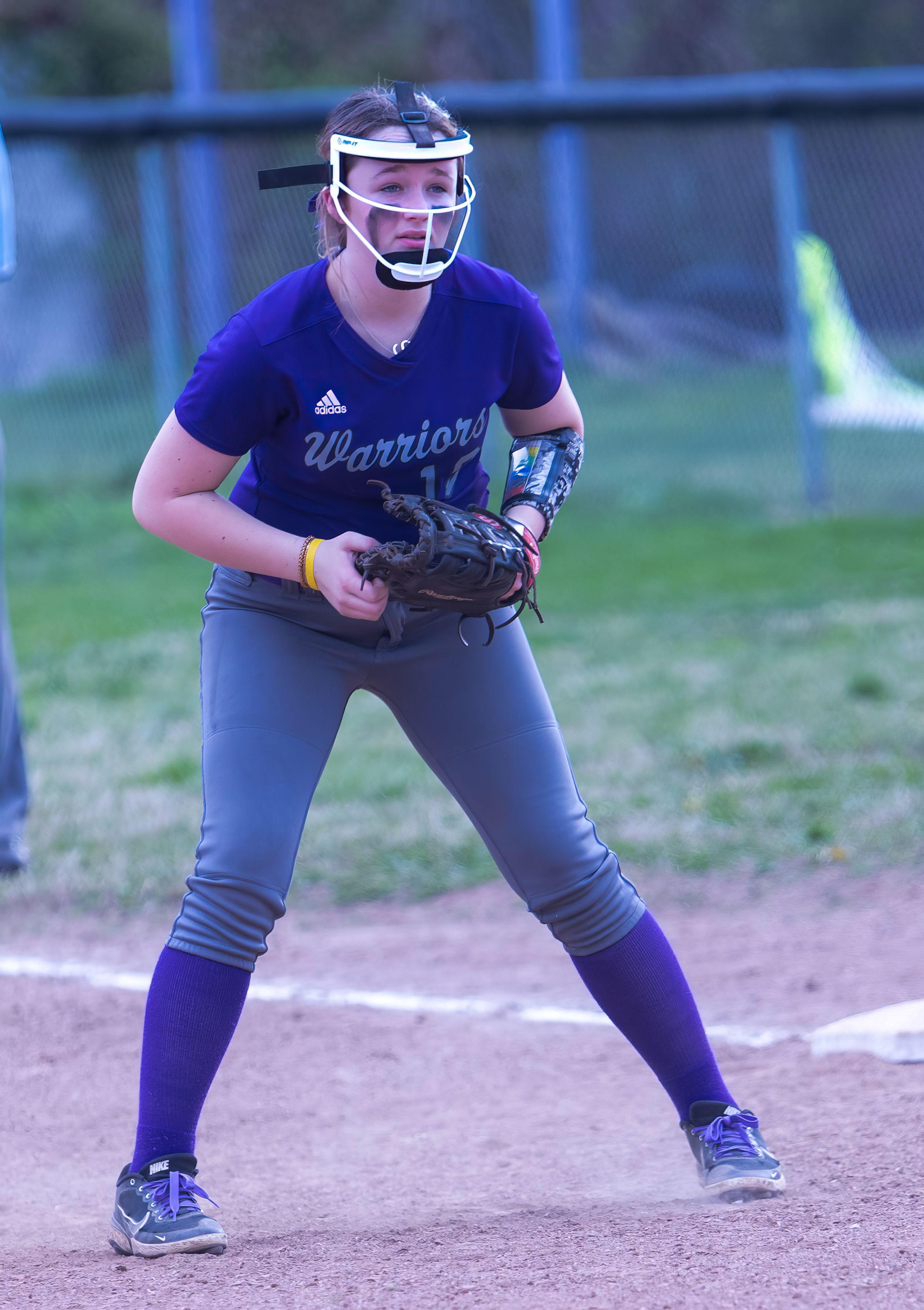 Softball player in Warriors uniform takes defensive stance on the infield.
Softball riverside high school kanawha county