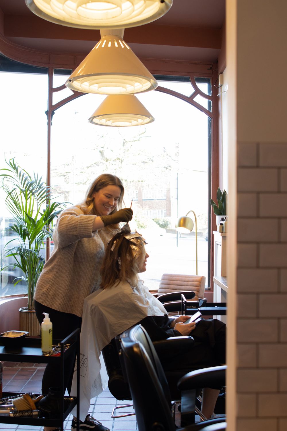 Interior cafe scene with pendant lighting and modern furnishings.