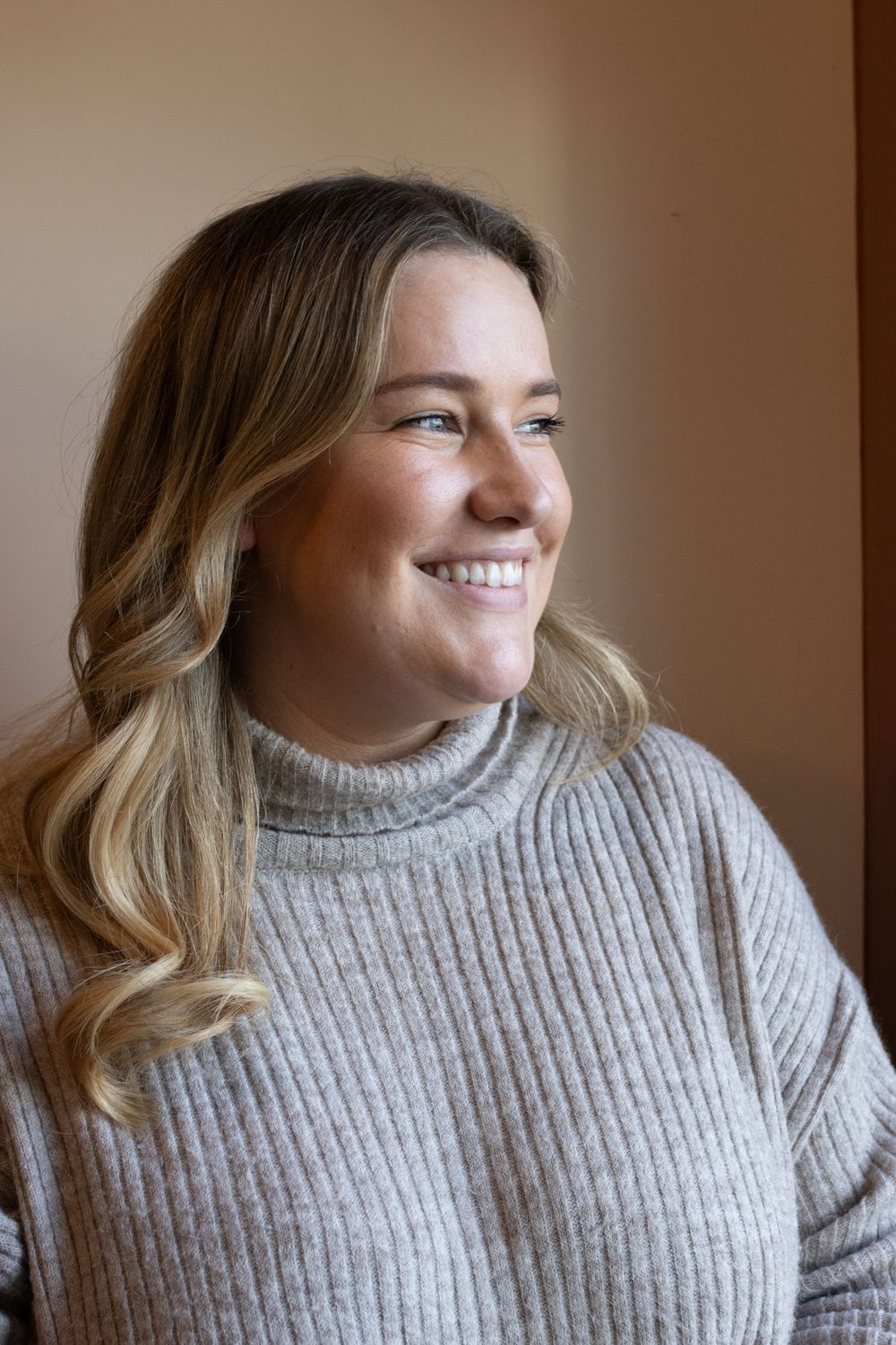 Casual portrait sequence featuring a grey turtleneck sweater and natural lighting.