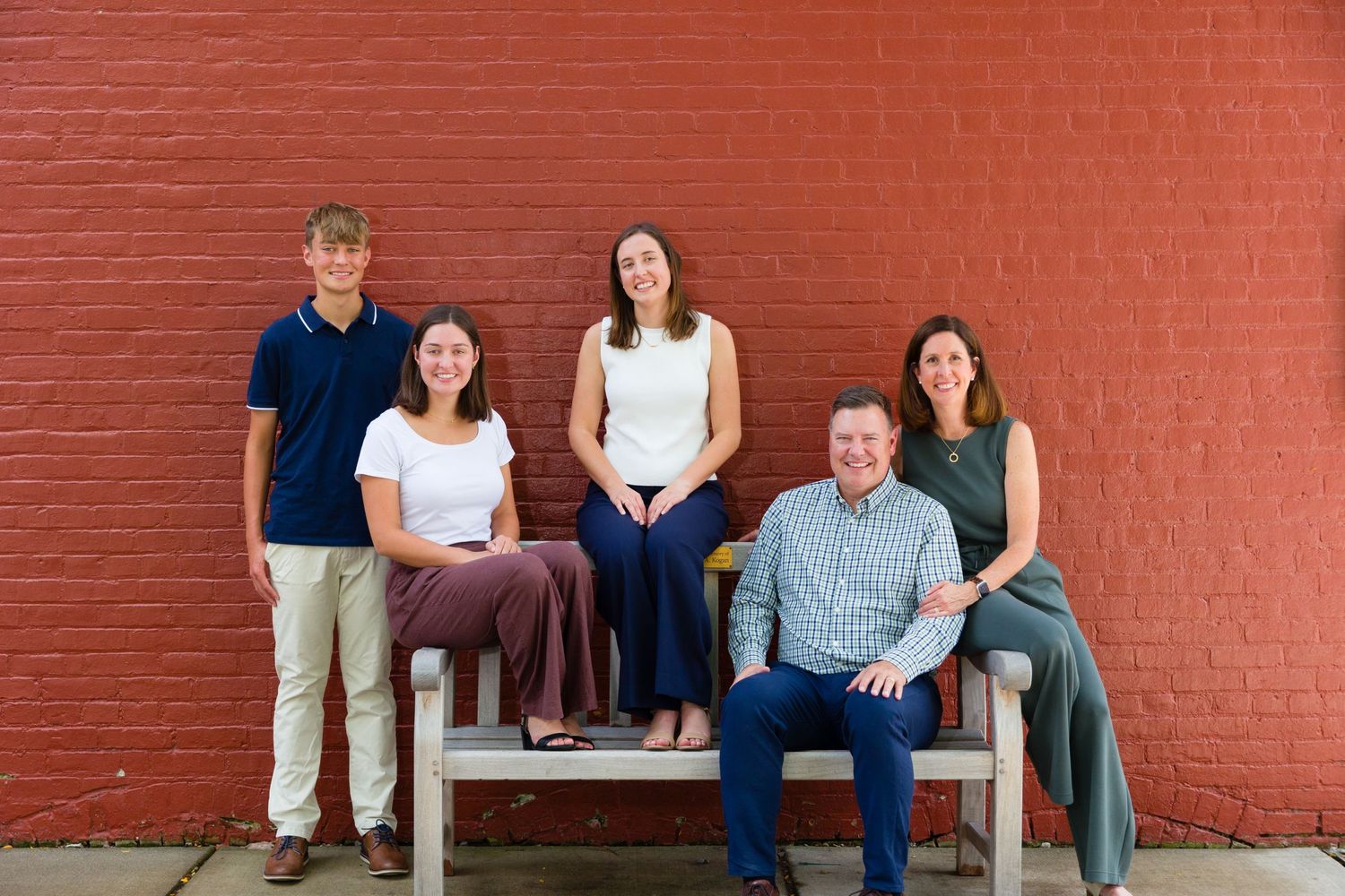 Love the red brick wall along Main Street in Zionsville for family pics.