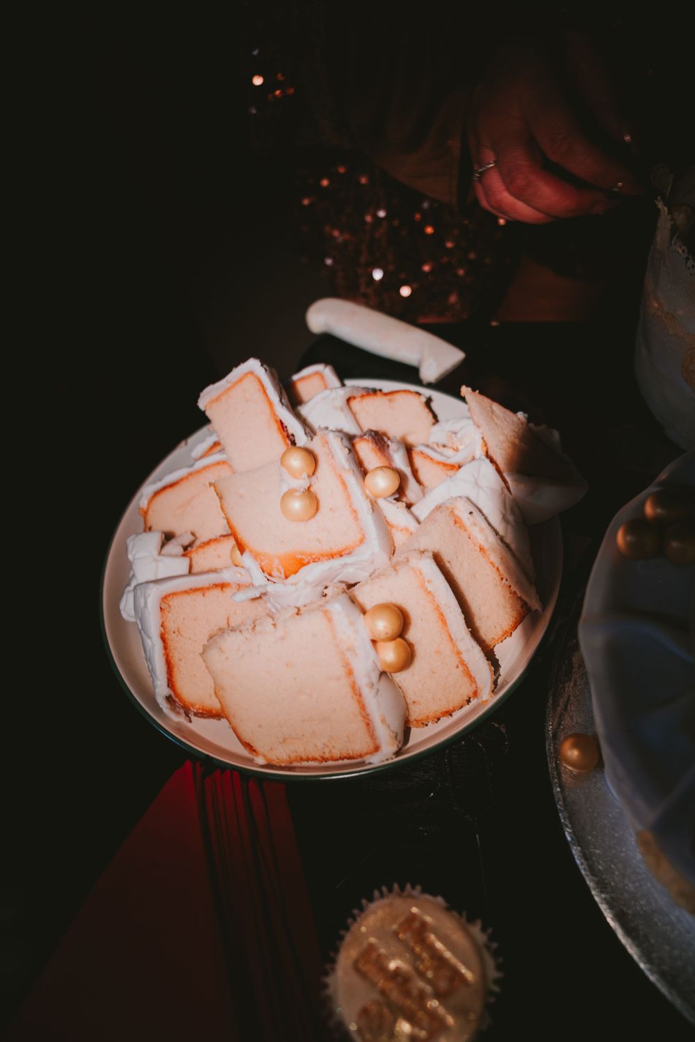 A warm festive drink topped with whipped cream and dusted with cocoa powder in a geometric pattern design.
