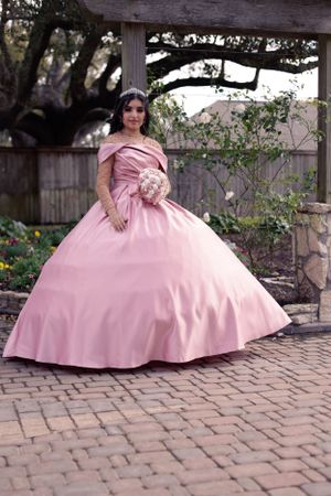 Sweet sixteen outdoor session/portrait of model showing off her pink dress.