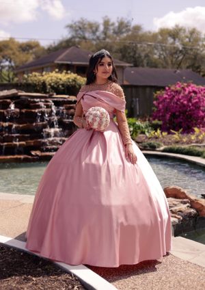 sweet sixteen outdoor portrait standing in front of a water cascade.