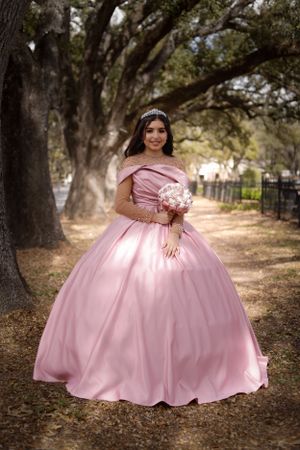 sweet sixteen outdoor portrait under the canopy of tress.