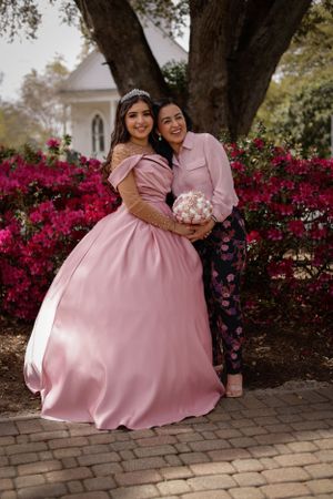 sweet sixteen outdoor portrait of daughter and mother during her quince photoshoot.