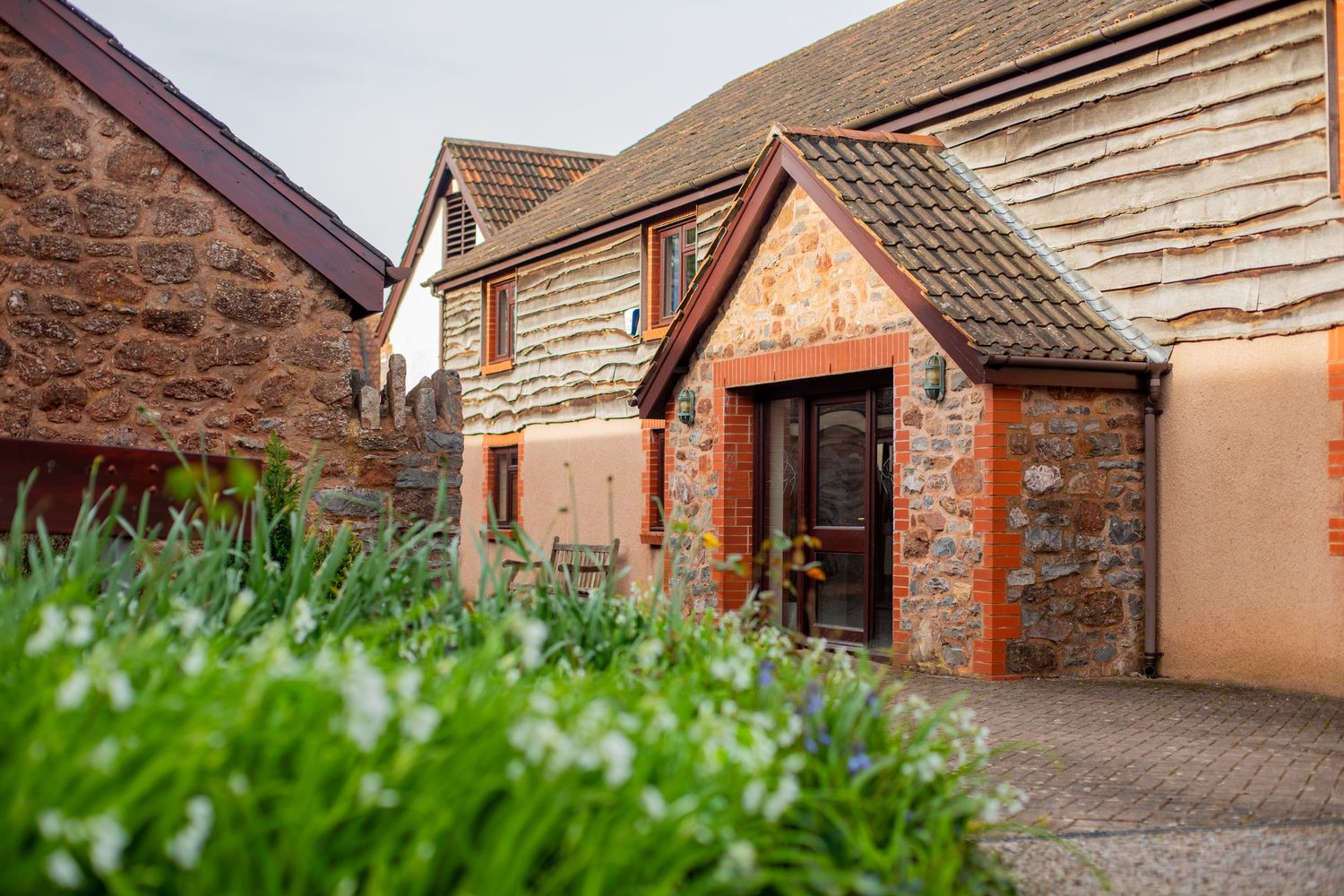 Entrance to office space with wildflowers at Swallow Court, Devon