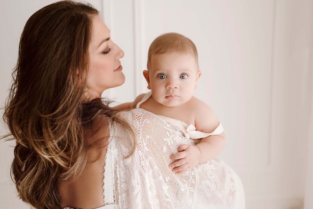 fotografia di una mamma con il suo piccolo