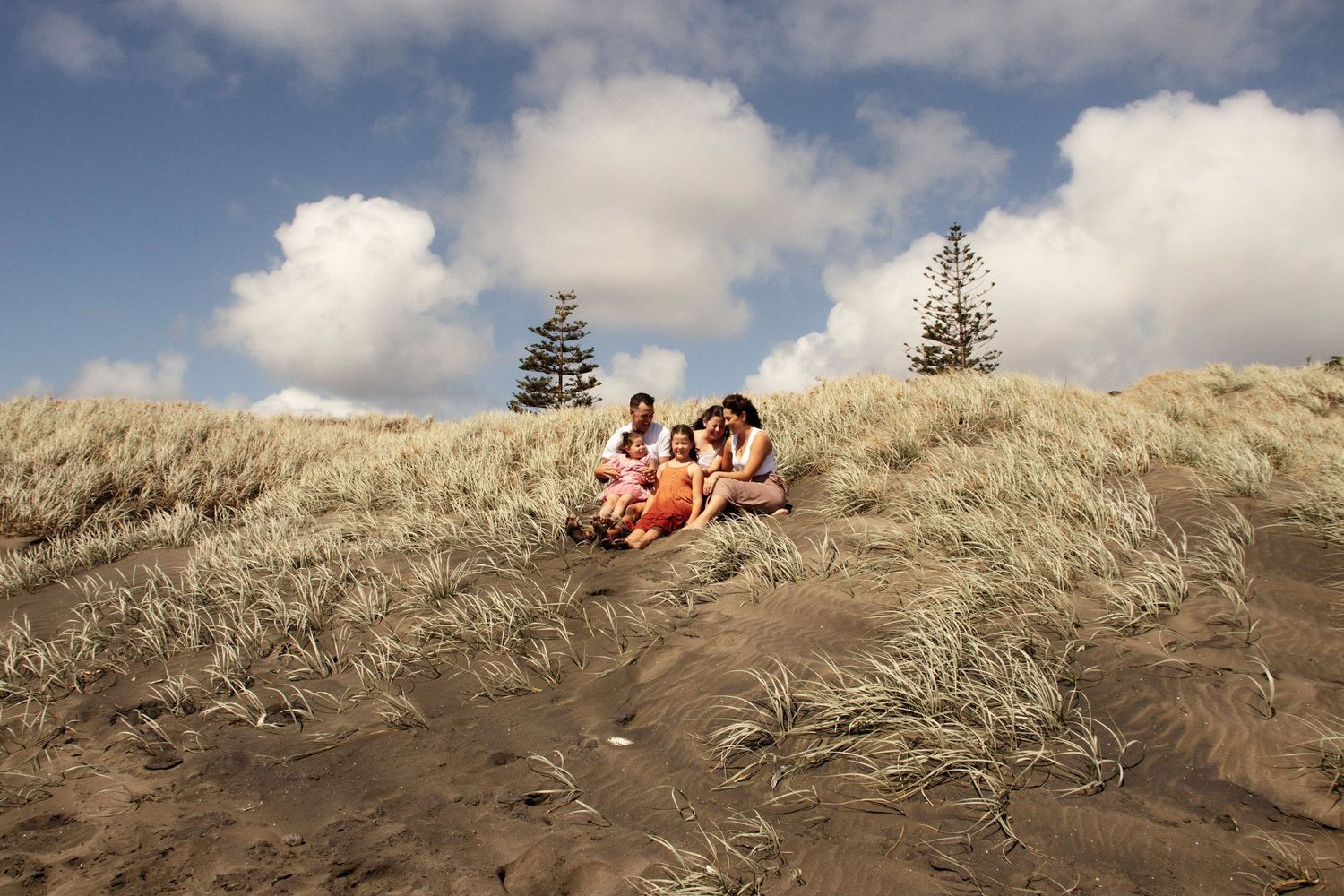 Family photoshoot at the beach during golden hour