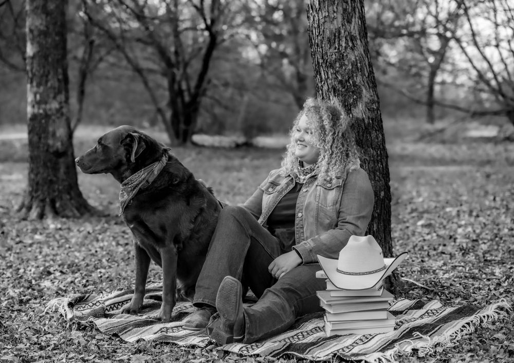 Black and white photos of someone relaxing under trees with books and a cowboy hat.