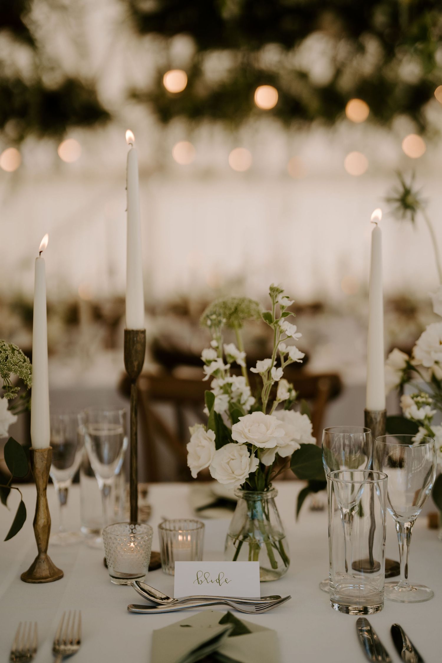 wedding flowers and candles decorating tables at hamswell house wedding in bath
