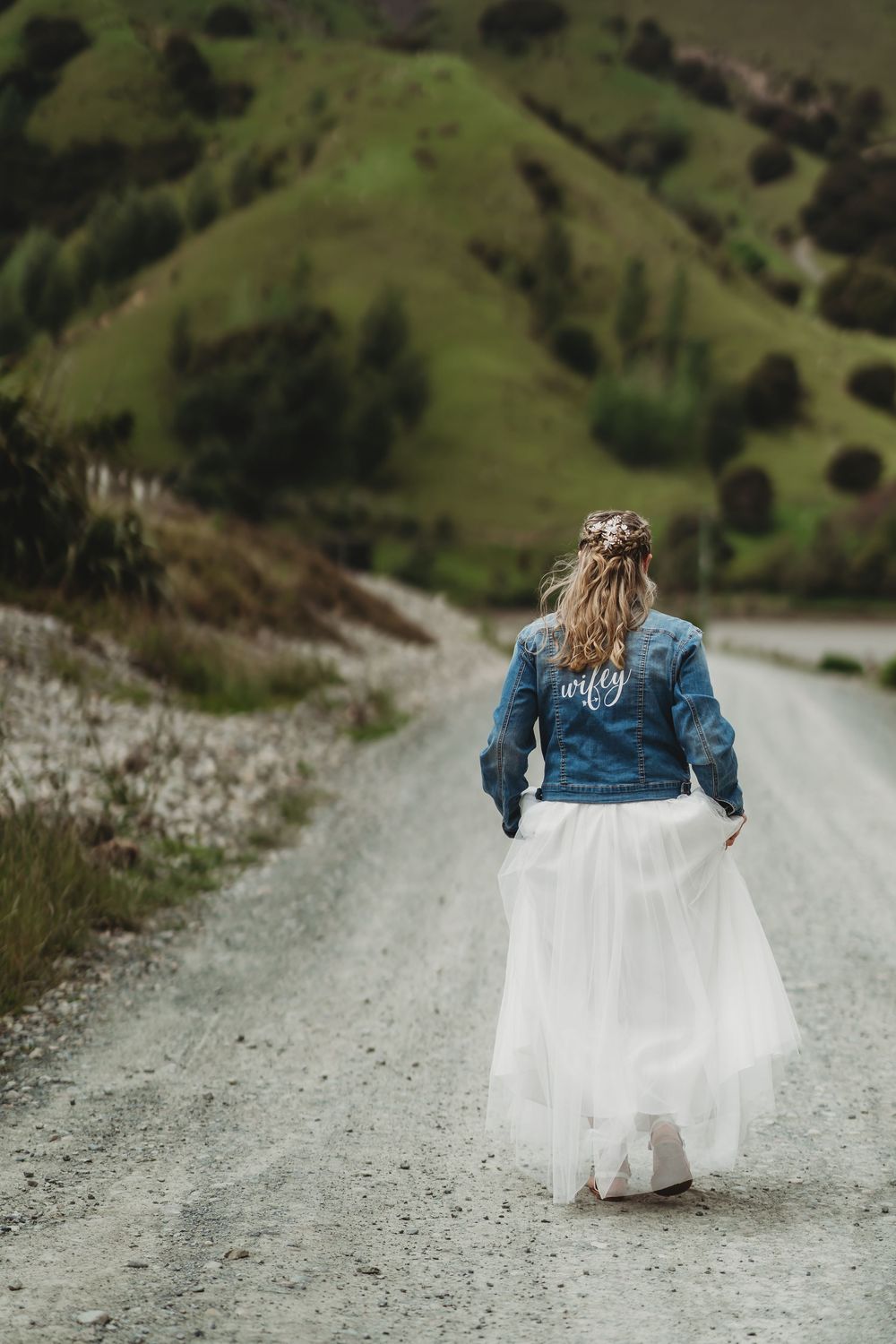 Bride on country road, rural wedding photos, bride with denim jacket, wedding photography Nelson, wedding photographer Nelson