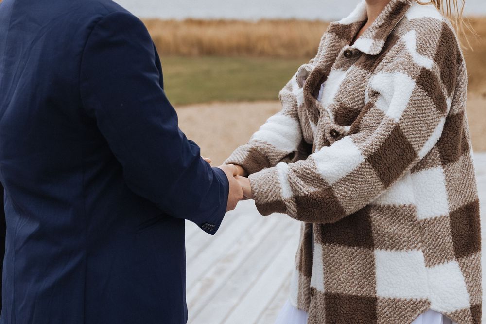 Bride and groom exchange vows during maritime wedding ceremony in New Brunswick, fall October wedding photography Confederation Bridge PEI